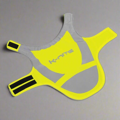 Hi-vis dog reflective jacket in fluorescent yellow with grey strips for outdoor safety during low light walks.