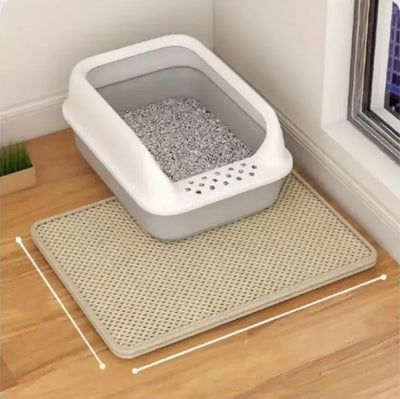Double-layer anti-tracking cat litter mat under a litter box, capturing stray litter and keeping floors clean.